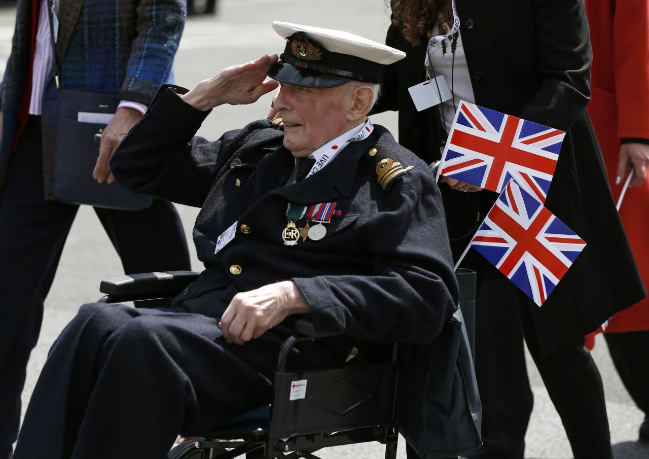 A veteran salutes during an armed forces and veterans' parade in London on Sunday, May 10, the final day of commemoration of the 70th anniversary of Victory in Europe day.