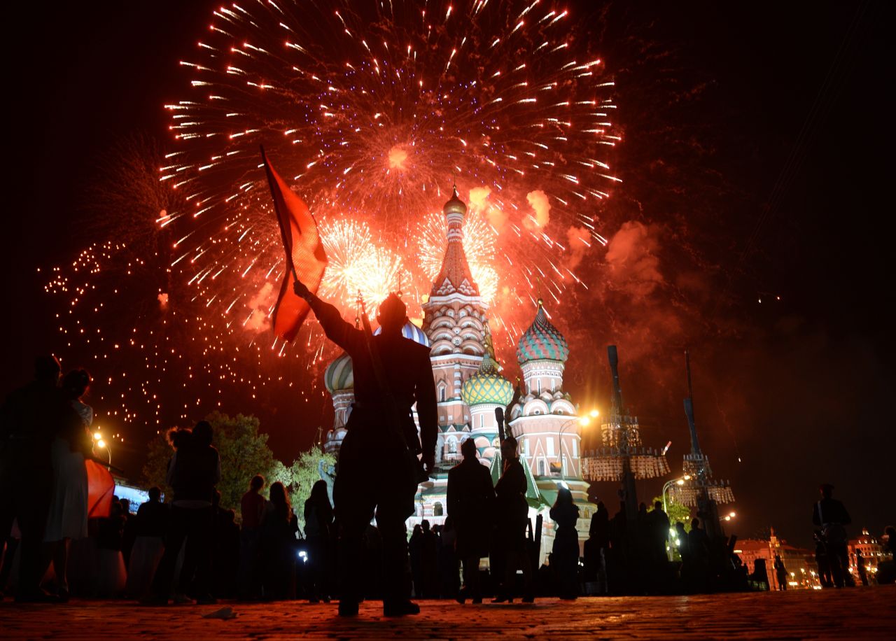 Actors dressed in World War II-era Soviet uniforms watch fireworks over St. Basil Cathedral in Moscow's Red Square on Saturday, May 9, after a concert marking the 70th anniversary of the defeat of Nazi Germany. 