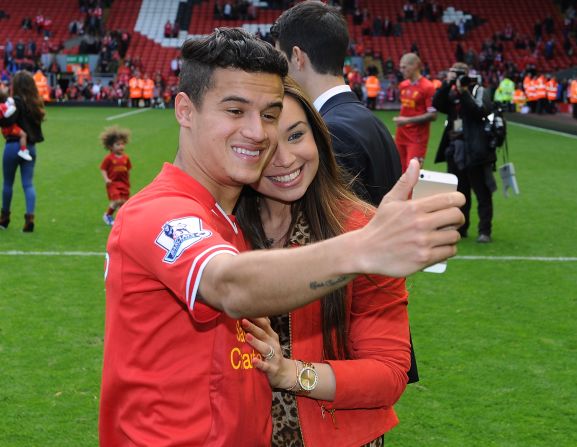 A selfie taken with wife Aine at Anfield during the 2013-14 end of season lap of honor. The pair are childhood sweethearts and she left everything in Brazil behind to support him when he moved to Europe.