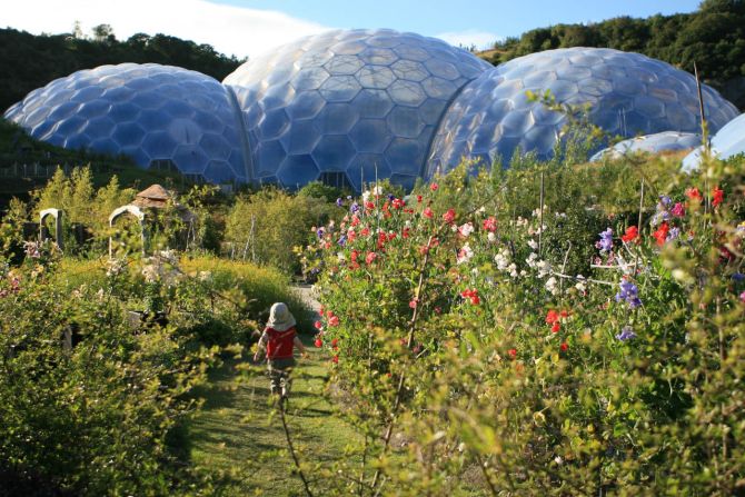 One of the most celebrated landmarks in Cornwall, England lies within the open clay pit of a former kaolinite mine. Known as The Eden Project, this series of interconnecting thermoplastic enclosures simulates different global environments. 