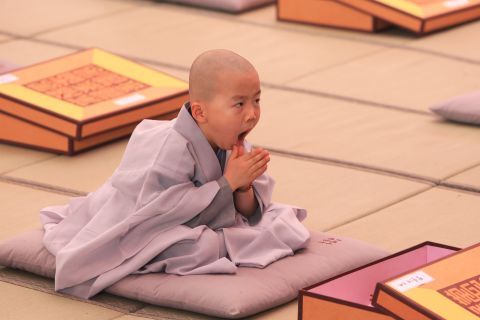 MAY 11 -- SEOUL, SOUTH KOREA: A child looks a little sleepy while attending the 'Children Becoming Buddhist Monks' ceremony at a Chogye temple ahead of Buddha's birthday. The children will stay at the temple to learn about Buddhism for 14 days. Buddha was born approximately 2,559 years ago, and although the exact date is unknown, Buddha's official birthday is celebrated on the full moon in May in South Korea, which is on May 25 this year.