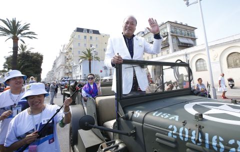 Li Jinyuan waves to the crowds in a parade on May 8 in Nice, France.
