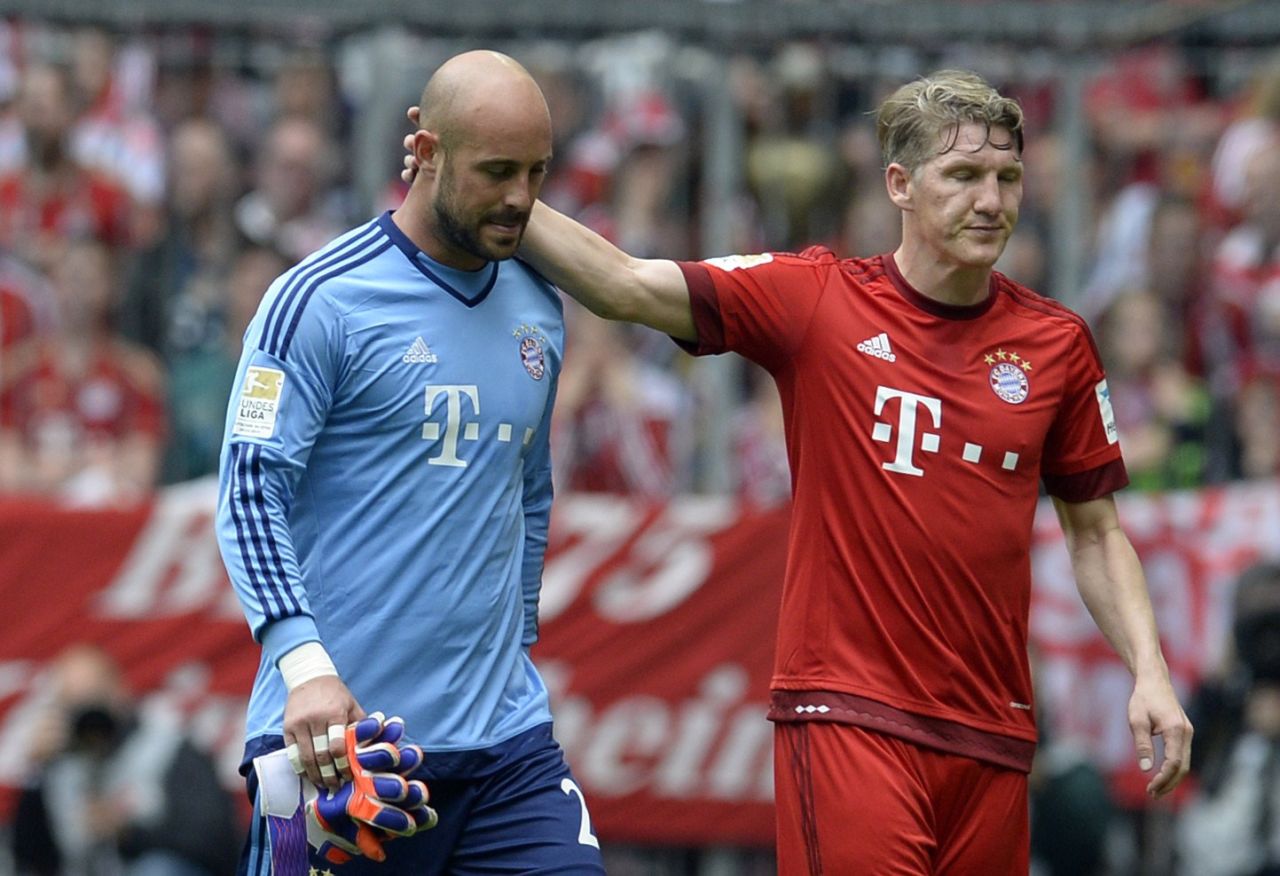 Bastian Schweinsteiger consoles Reina as he makes his way off the pitch. It was only the third game the Spaniard had played in all season.