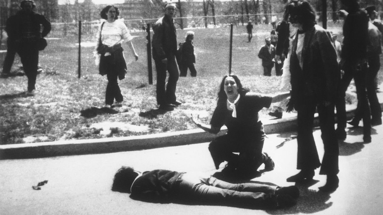 Four students died and nine others were wounded on May 4, 1970, when members of the Ohio National Guard opened fire on students protesting the Vietnam War at Kent State University in Ohio. In this Pulitzer Prize-winning photo, taken by Kent State photojournalism student John Filo, Mary Ann Vecchio can be seen screaming as she kneels by the body of slain student Jeffrey Miller.