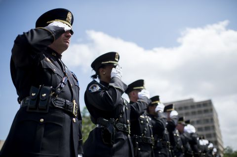 Honor guard members from the U.S. Capitol Police salute during the Washington Area Law Enforcement Memorial Service, which was held outside of D.C. Police headquarters on Monday, May 11. The event honored deceased local law enforcement officers. National Police Week runs through Saturday, May 16.