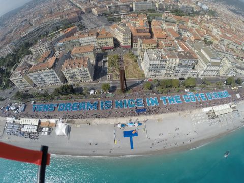 Staff members lined up on the waterfront to spell out the phrase "Tiens' dream is nice in the Côte d'Azur."