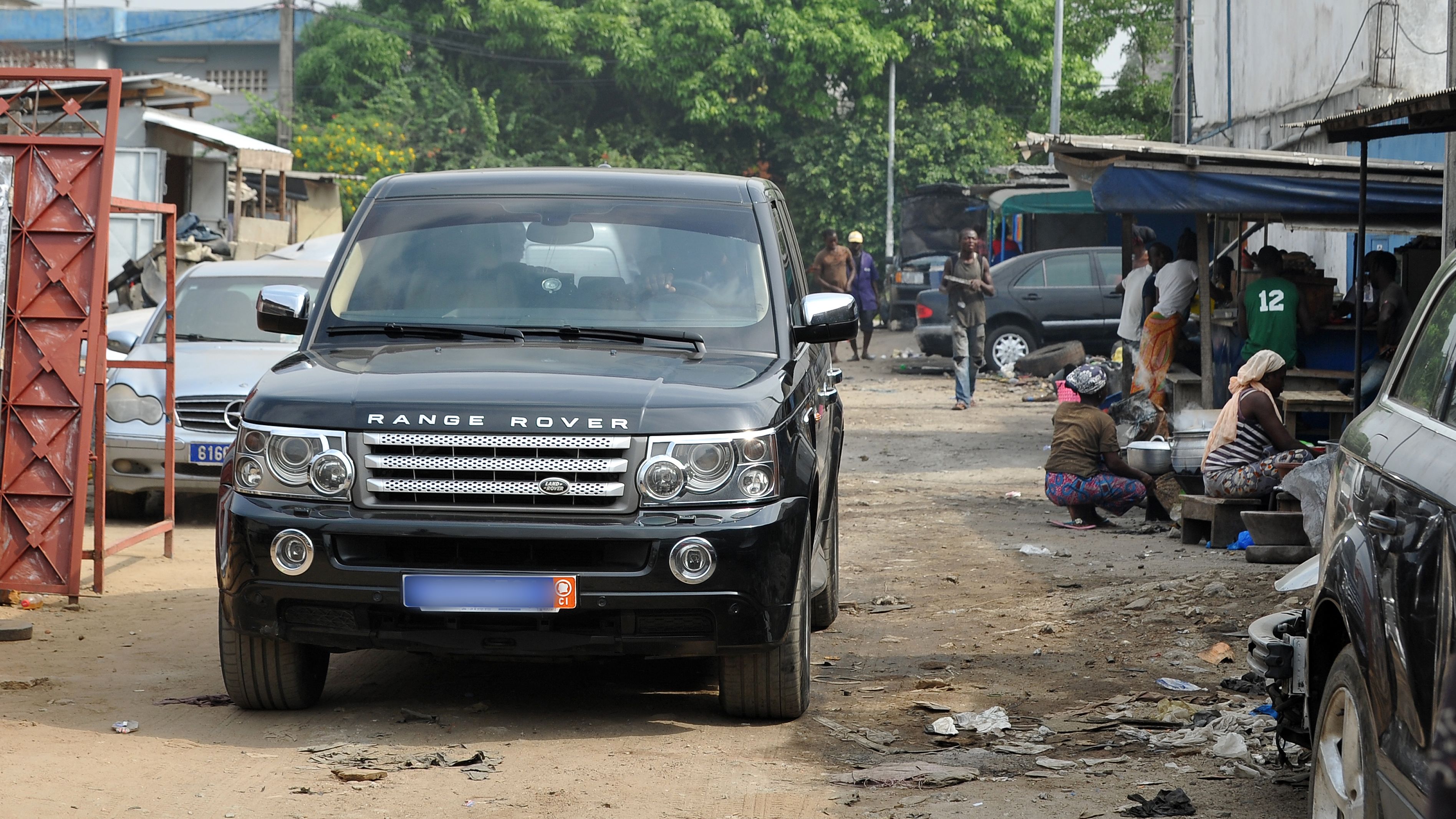 Range Rovers and other luxury cars are no strange sight in the streets of Abidjan, capital of Ivory Coast. Around 20% of the city's residents live in slums. 