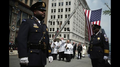 The procession arrives at the annual Blue Mass on May 5. Law enforcement representatives gathered to continue the tradition of congregating annually "to pray for their comrades who fell in the line of duty."