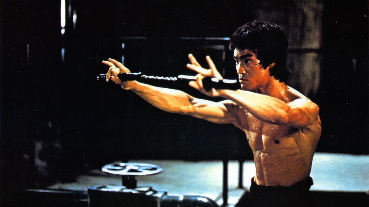 Martial-arts actor Bruce Lee, seen here training in a scene from the film "Enter the Dragon," dies in July 1973 just days before the movie's release. He was 32. The film would cement Lee's legend and bring martial arts to the forefront of pop culture.