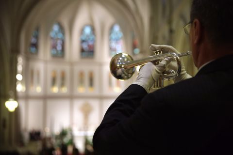 Taps is played during the Mass on May 5.