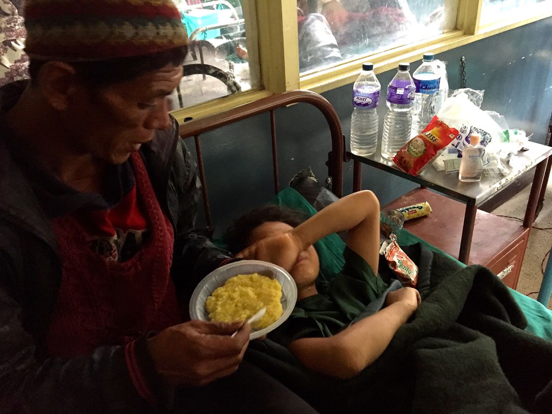 Maya's father tries to feed her lentils and rice, but in the days after the amputation she had little appetite and cried all the time.