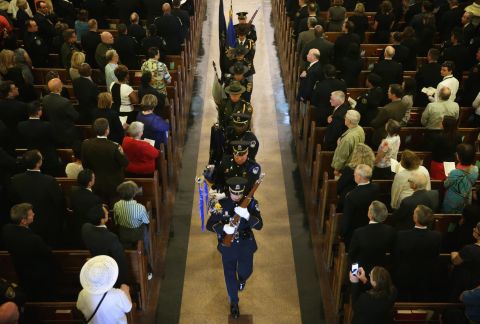 Members of the color guard exit St. Patrick's Catholic Church on May 5.