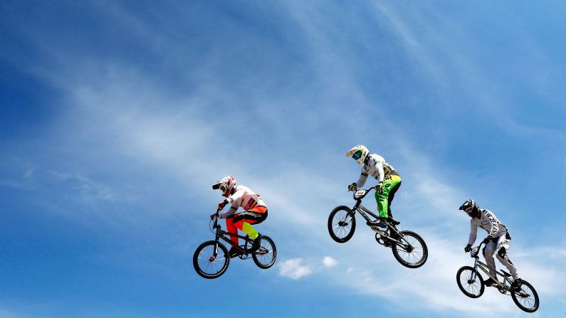 From left, Sam Willoughby, Anthony Dean and Daniel Franks compete in a BMX Supercross race Sunday, May 10, in Arnhem, Netherlands.