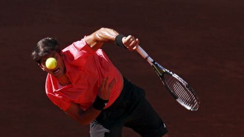 Fernando Verdasco serves to David Ferrer during their match at the Madrid Open on Thursday, May 7.