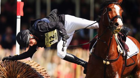 Niklas Bschorer fights to stay on his horse, TomTom Go 3, during the Badminton Horse Trials in Badminton, England, on Saturday, May 9. 