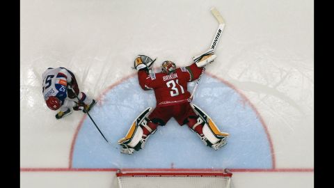 Belarus goalie Igor Brikun sprawls out to save a penalty shot taken by Russia's Sergei Shirokov during a World Championship game played Saturday, May 9, in Ostrava, Czech Republic. Russia still won the game 7-0.