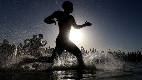 Racers enter the water Saturday, May 9, during the Half Ironman event in Palma de Mallorca, Spain.