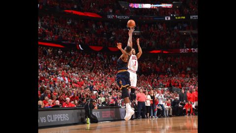 Chicago's Derrick Rose shoots a 3-pointer to win Game 3 of the NBA playoff series against Cleveland on Friday, May 8. The Bulls took a 2-1 series lead with the clutch shot.