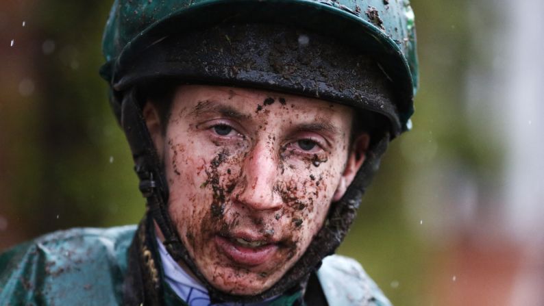 A muddy James Sullivan returns to the jockeys' weighing room Friday, May 8, at Chester Racecourse in Chester, England.