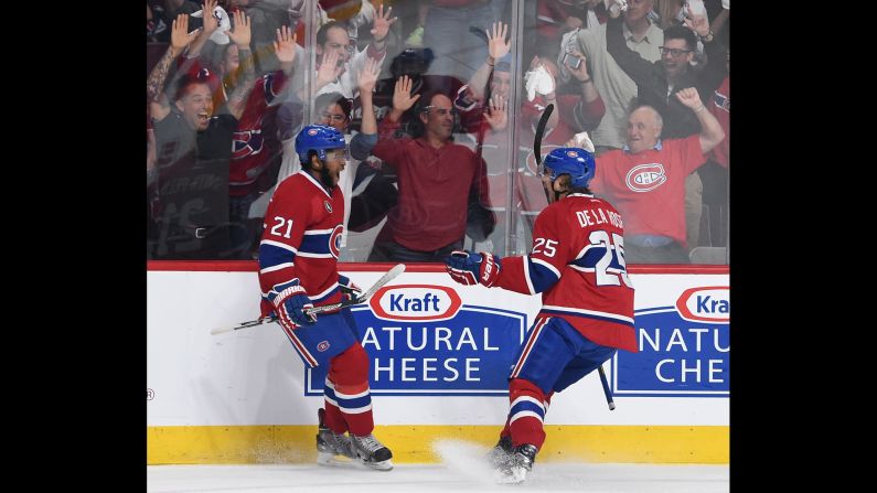 Montreal's Devante Smith-Pelly, left, celebrates with teammate Jacob De La Rose after scoring a goal in Game 5 of their NHL playoff series with Tampa Bay on Saturday, May 9. Montreal won 2-1 to stave off elimination.