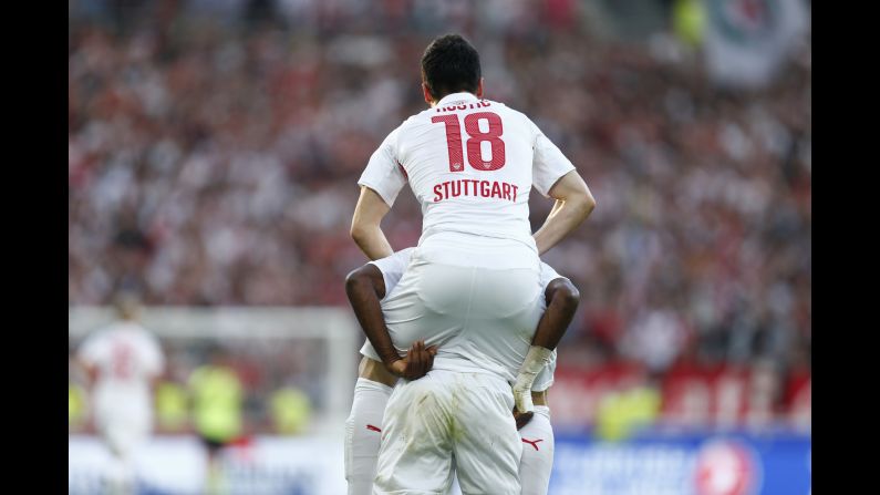 Stuttgart's Filip Kostic jumps on the back of a teammate as he celebrates scoring a goal against Mainz during a German league match in Stuttgart on Saturday, May 9. Stuttgart won the match 2-0. <a href="index.php?page=&url=http%3A%2F%2Fwww.cnn.com%2F2015%2F05%2F05%2Fsport%2Fgallery%2Fsports-what-a-shot-0505%2Findex.html" target="_blank">See 38 amazing sports photos from last week</a>