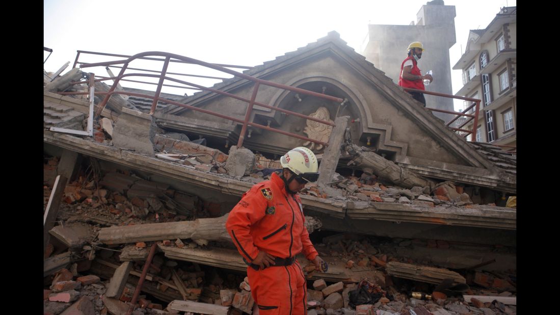 A rescue worker from Mexico stands at the site of a collapsed building in Kathmandu on May 12.