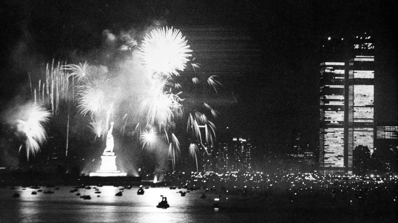 Fireworks at the Statue of Liberty light up the New York Harbor on July 4, 1976, as the country celebrates the bicentennial anniversary of the Declaration of Independence. Patriotic events took place around the country that year.