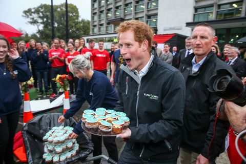MAY 12 -- CHRISTCHURCH, NEW ZEALAND: Prince Harry helps the Student Volunteer Army hand out cupcakes during a visit to the University of Canterbury. The prince is in New Zealand attending events in Wellington, Invercargill, Stewart Island, Christchurch, Linton, Whanganui and Auckland.