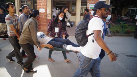 An injured person is carried in Kathmandu on May 12.