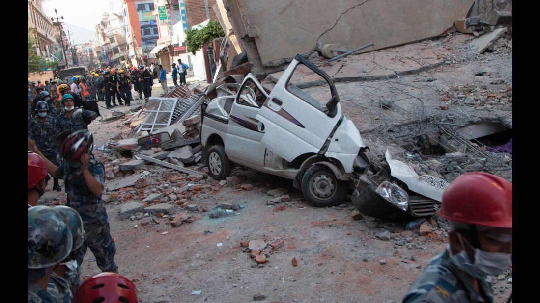 A car is smashed under the weight of a collapsed building in Kathmandu on May 12.