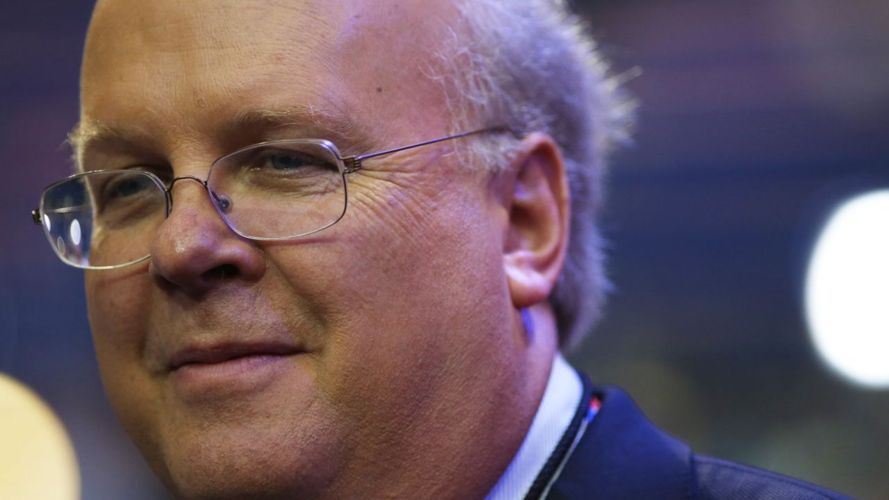 Karl Rove, former deputy chief of staff and senior policy adviser to former US President George W. Bush, walks on the floor before the start of the second day of the Republican National Convention on August 28, 2012 in Tampa, Florida. 