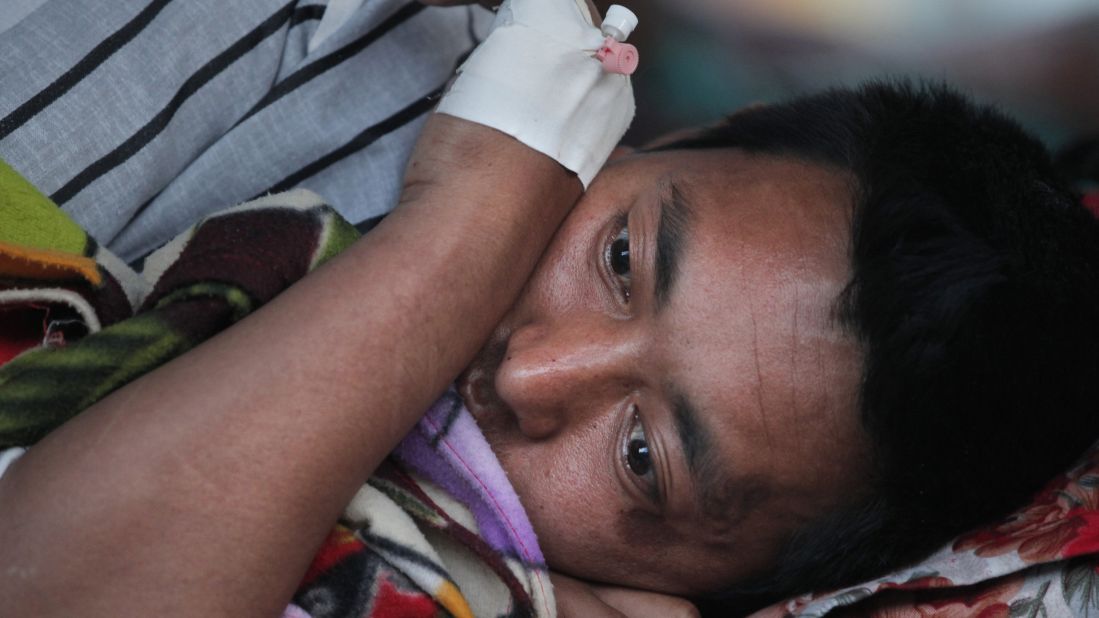 An injured man rests at a hospital in Kathmandu on May 12.