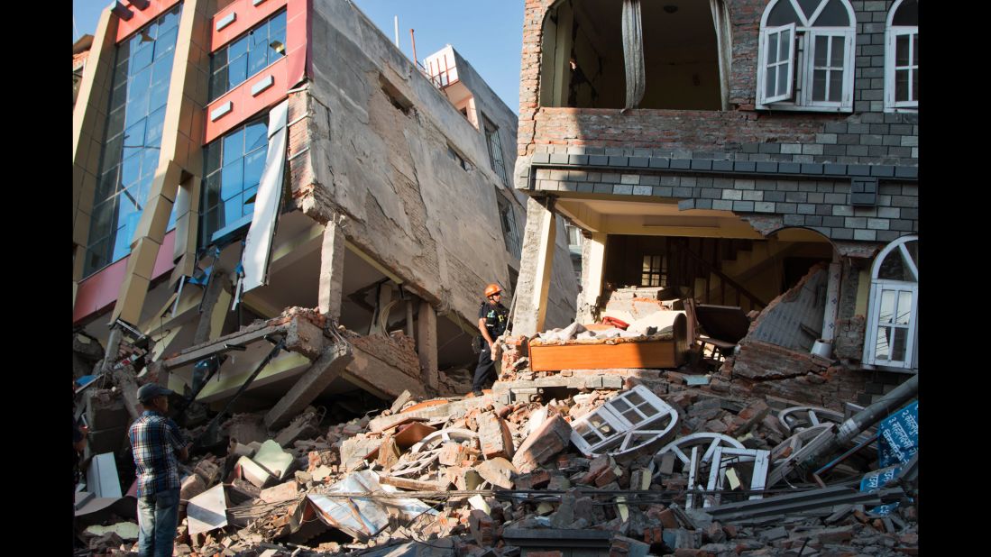 People look through the debris of buildings in Kathmandu on May 12.