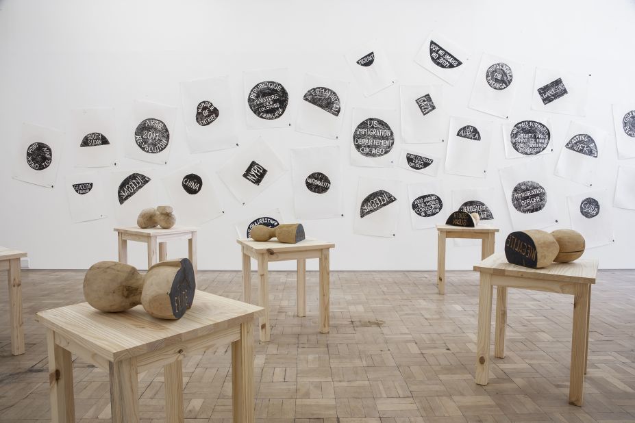 <em>Barthélémy Toguo, The New World Climax, 2000--2014. </em><br /><br />The Cameroonian artist often works with a mix of media -- prints, still images, video and sculpture. But one of his offerings at this year's exhibition is using wooden stamps, tables, ink prints on paper. 