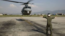 Cpl. Mackenzie Higgins guides a UH-1Y Huey for takeoff at the Tribhuvan International Airport in Kathmandu, Nepal, May 5.
