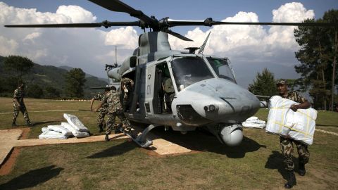 Nepali military service members unload supplies from a UH-1Y Huey in Charikot, Nepal, on May 5.