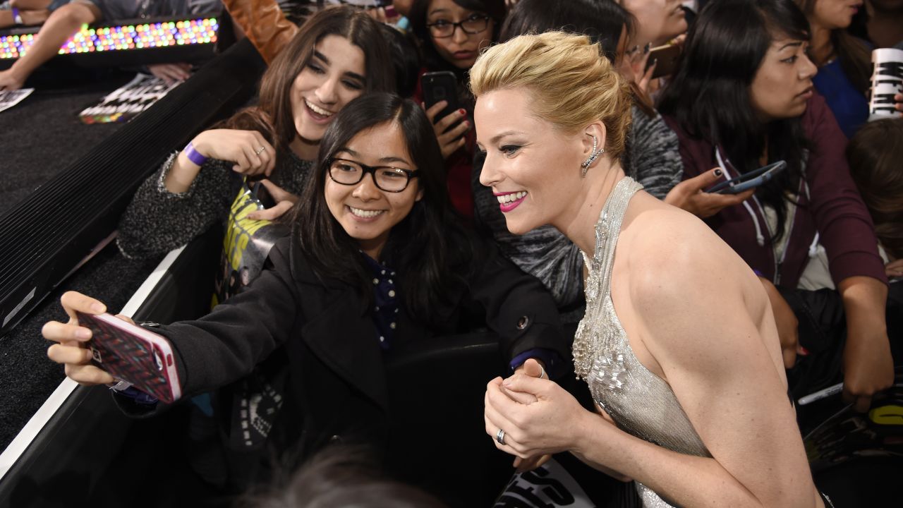 Actress Elizabeth Banks, director of "Pitch Perfect 2," poses with fans at the film's premiere in Los Angeles on Friday, May 8.