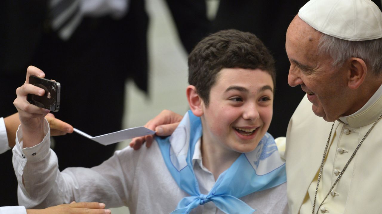 Pope Francis poses for a boy's selfie during an audience at the Vatican on Thursday, May 7.
