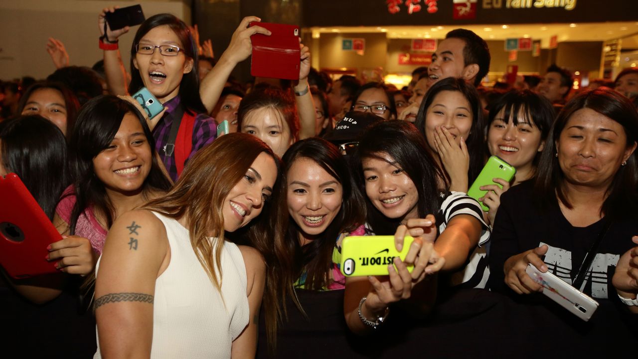 Fans in Singapore take a selfie with singer Melanie Chisholm, one of the former Spice Girls, during an "Asia's Got Talent" showcase on Friday, May 8.
