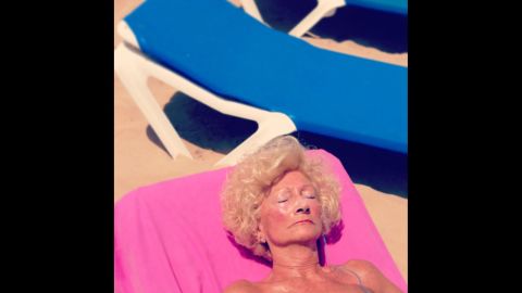 A woman sunbathes in the Spanish town of Benidorm, a beach haven for many working-class tourists and pensioners from northern Europe. "Scenes of Radioactive Life" is Maria Moldes' two-year photographic ode to Benidorm, highlighting the extravagance of the place and its characters. "It is an endless source of images," she said.