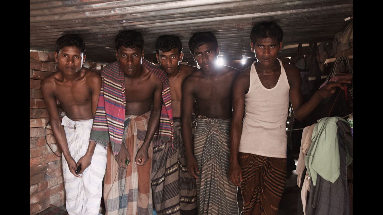 Five young workers inside their house in the Gazipur area. "The houses were very bad -- only 1.5 meters high, so you can't even stand up inside -- and (they were) without electricity," photographer Raffaele Petralla said.