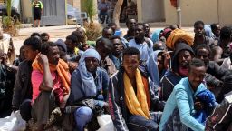 Migrants from sub-Saharan Africa sit at a center for illegal migrants in the al-Karem district of the Libyan eastern port city of Misrata on May 9, 2015, as they wait to be transported to a different detention center. Mohammed Khalifa al-Guwail, the acting prime minister of Libya's disputed government, urged European Union countries to help his administration tackle illegal immigration by sending boats for the coastguard. AFP PHOTO / MAHMUD TURKIAMAHMUD TURKIA/AFP/Getty Images