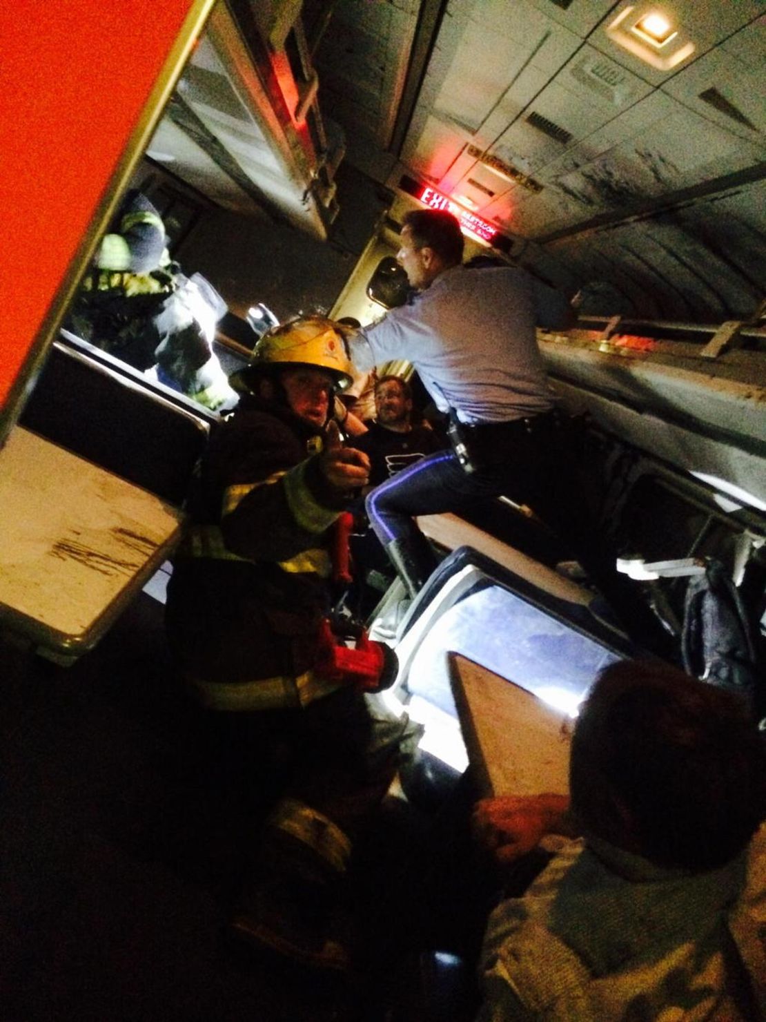 Former U.S. Rep. Patrick Murphy tweeted he was aboard the train when it crashed. "Helping others," he said. "Pray for those injured." Later he shared this photo that showed a firefighter inside the train.