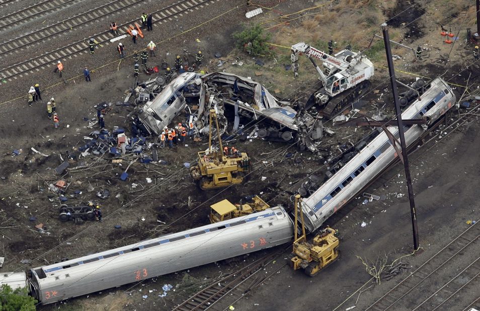 Emergency personnel work at the scene of a deadly train derailment in Philadelphia on Wednesday, May 13. An Amtrak train headed from Washington to New York City crashed Tuesday night in Philadelphia. Eight people were killed and more than 200 were injured.