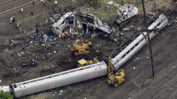 Emergency personnel work at the scene of a deadly train derailment in Philadelphia on Wednesday, May 13.