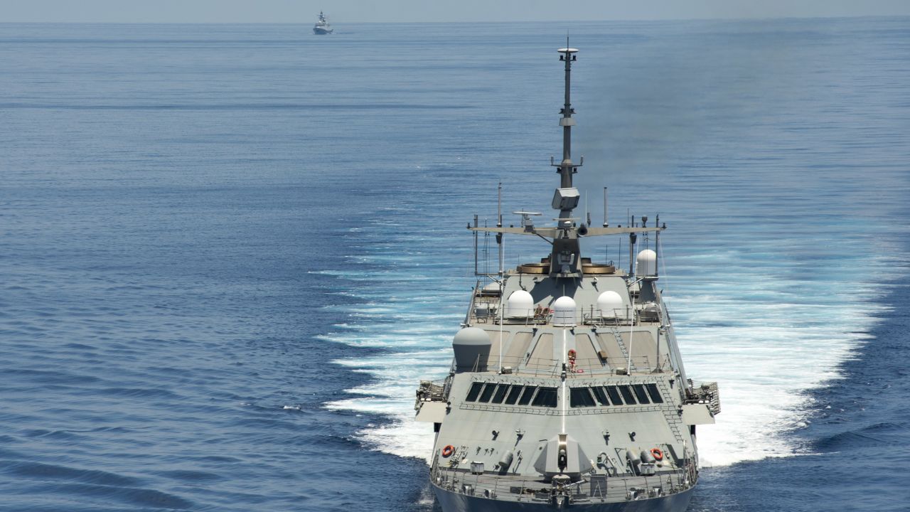 The littoral combat ship USS Fort Worth conducts patrols in international waters near the Spratly Islands as the Chinese guided-missile frigate Yancheng trails close behind.