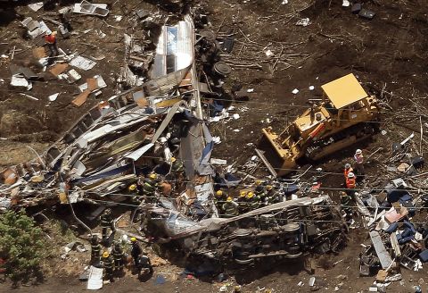 Crews work amid the wreckage on May 13.