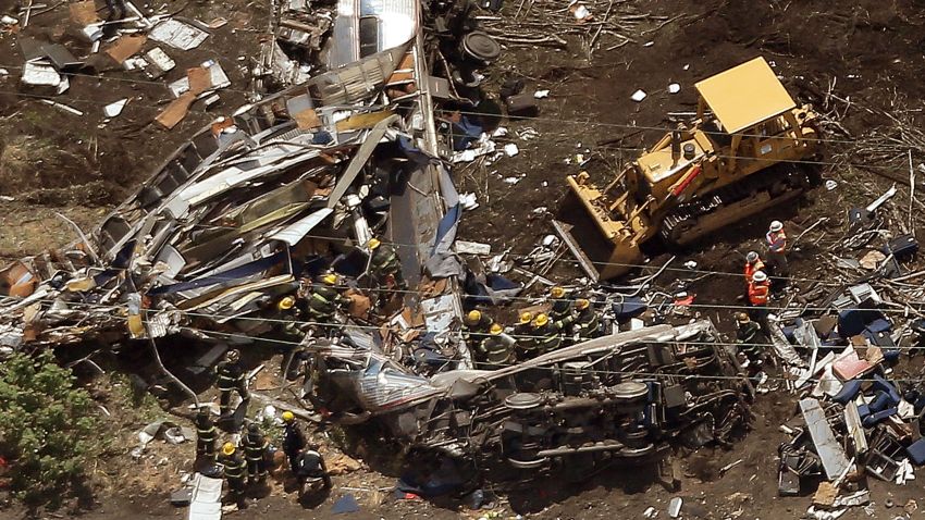 PHILADELPHIA, PA - MAY 13: Investigators and first responders work near the wreckage of Amtrak Northeast Regional Train 188, from Washington to New York, that derailed yesterday May 13, 2015 in north Philadelphia, Pennsylvania. At least six people were killed and more than 200 others were injured in the crash. (Photo by Win McNamee/Getty Images)