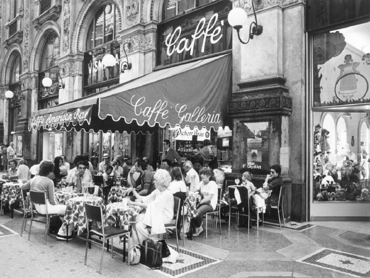 The design of Bar Luce echoes the architecture of the Galleria Vittorio Emanuele in Milan. Here, a shot of the café in the Galleria from 1978.