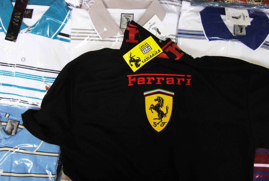"OK, this is a copy, not real, but no problem," a cheerful Thai woman says, pointing to a black knit polo shirt emblazoned with a Ferrari logo in Bangkok's wholesale and retail Pratunam Market.